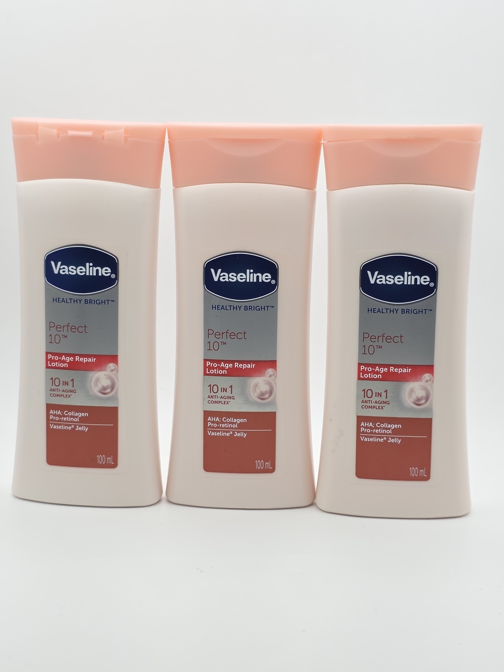 3 VaselineVaseline Healthy Bright Perfect 10 Pro-Age Repair Lotion — Peach/White